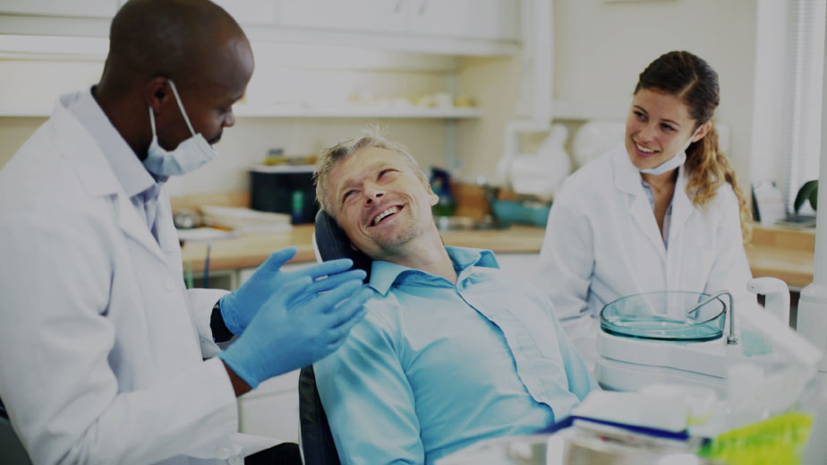 smiling man in dental chair